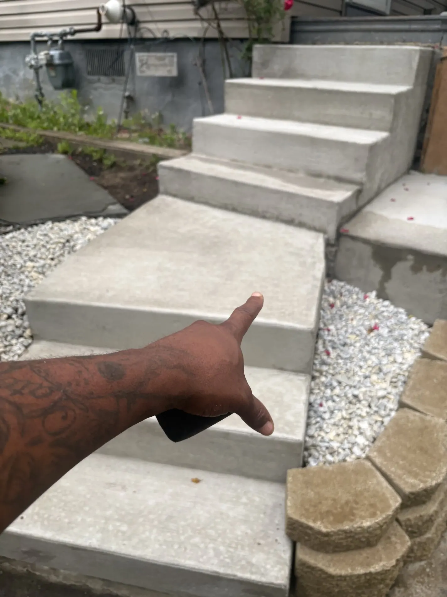 Concrete steps with gravel added along the side.